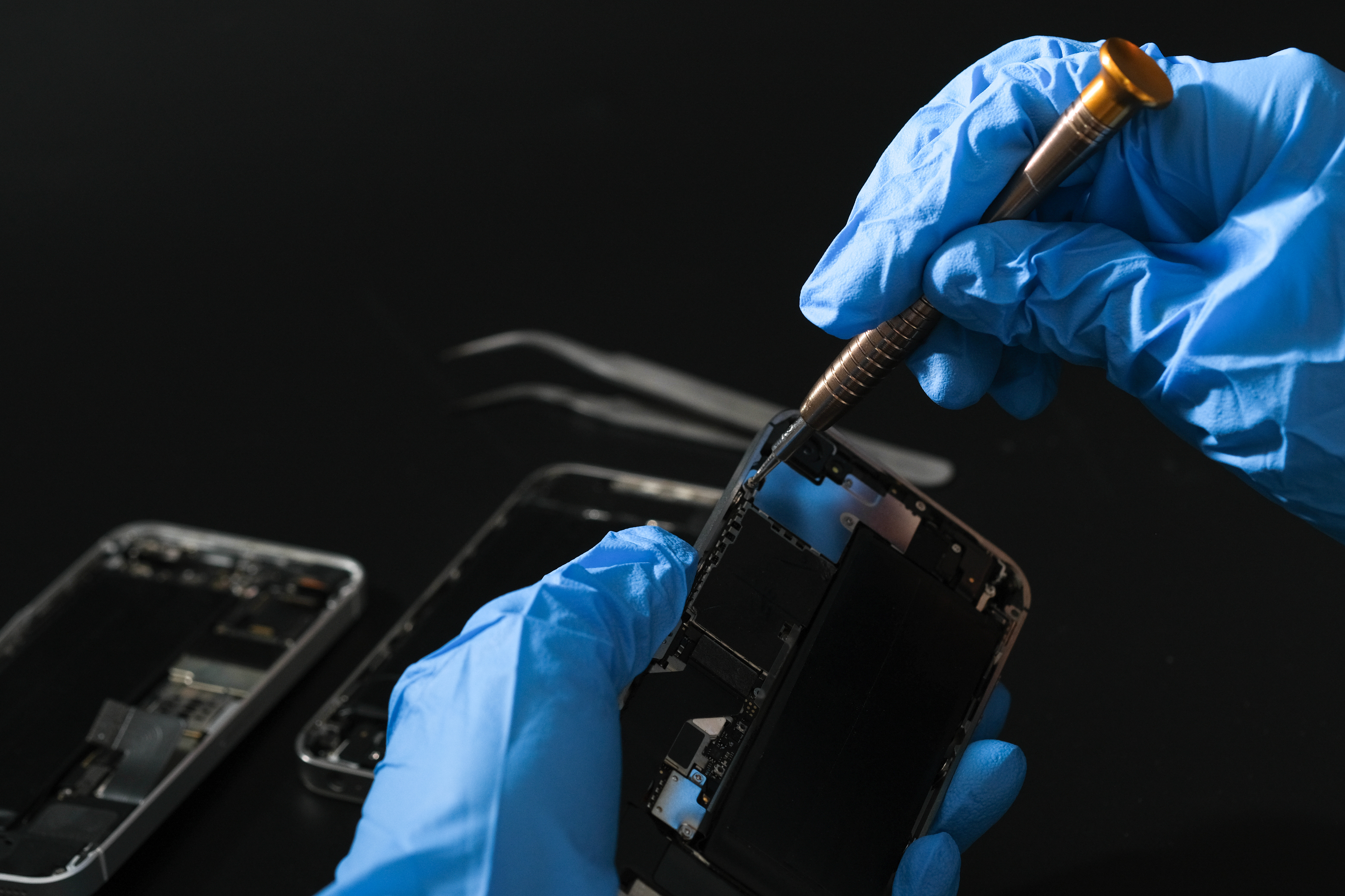 Technician repairing the Cell phone parts and tools for recovery repair phone smartphone